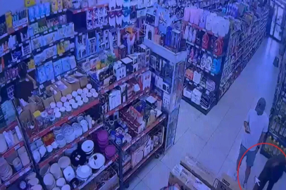 Zincir marketten televizyon çalan şüphelinin yakalandığı anlar kamerada